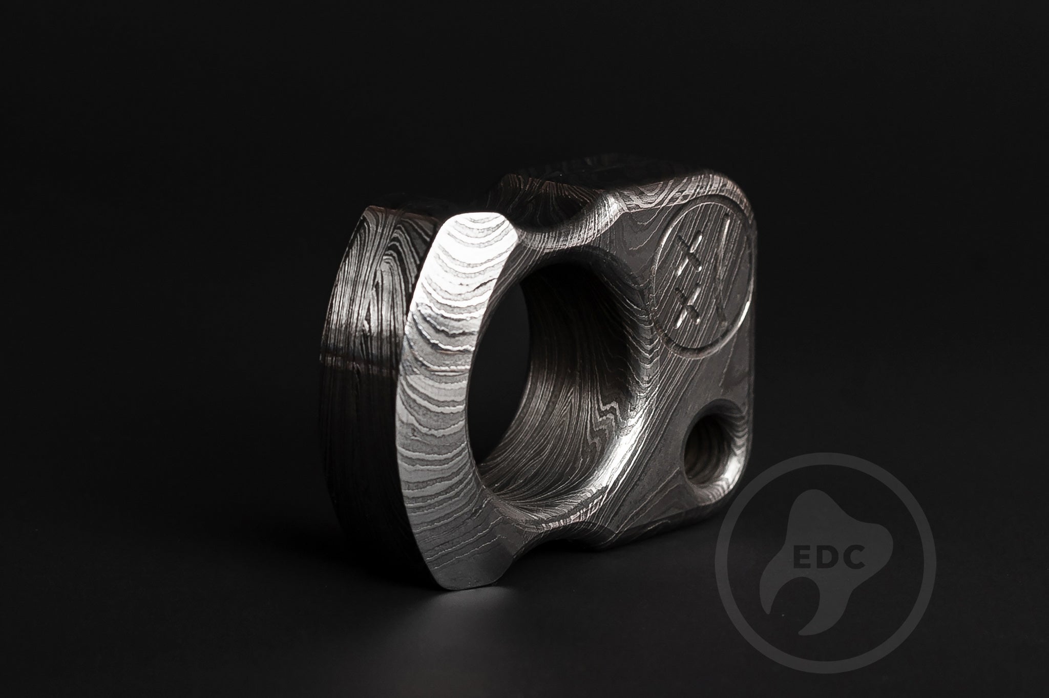 Detailed view of hand-polished and acid-etched Damascus steel texture-3