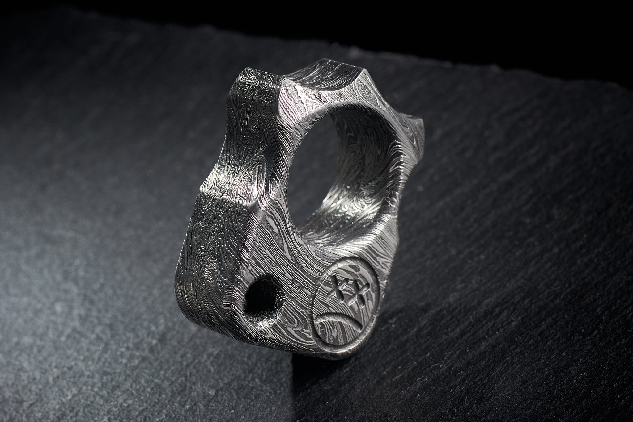 Side view of 140g heavyweight Damascus steel EDC sculpture