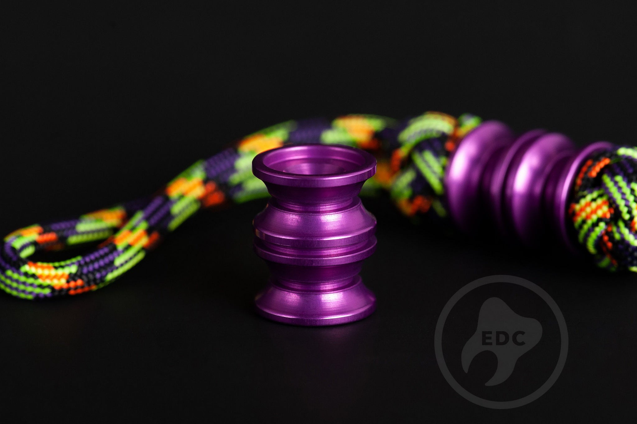 Purple Grooved Barrel bead showing the 6mm hole for 550 paracord.