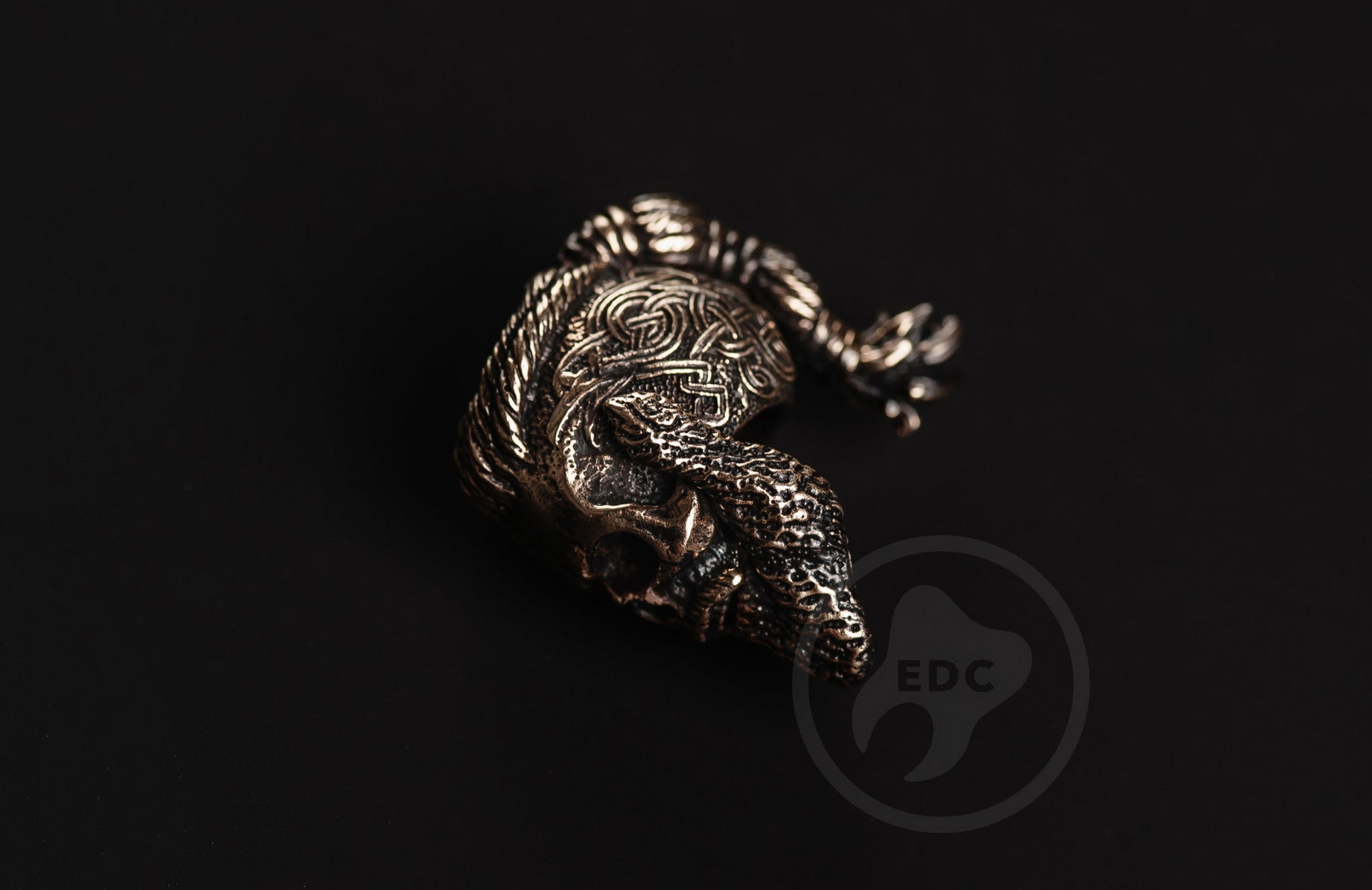 Close-up of the blackened finish and eye sockets on the brass Nordic warrior bead.-2