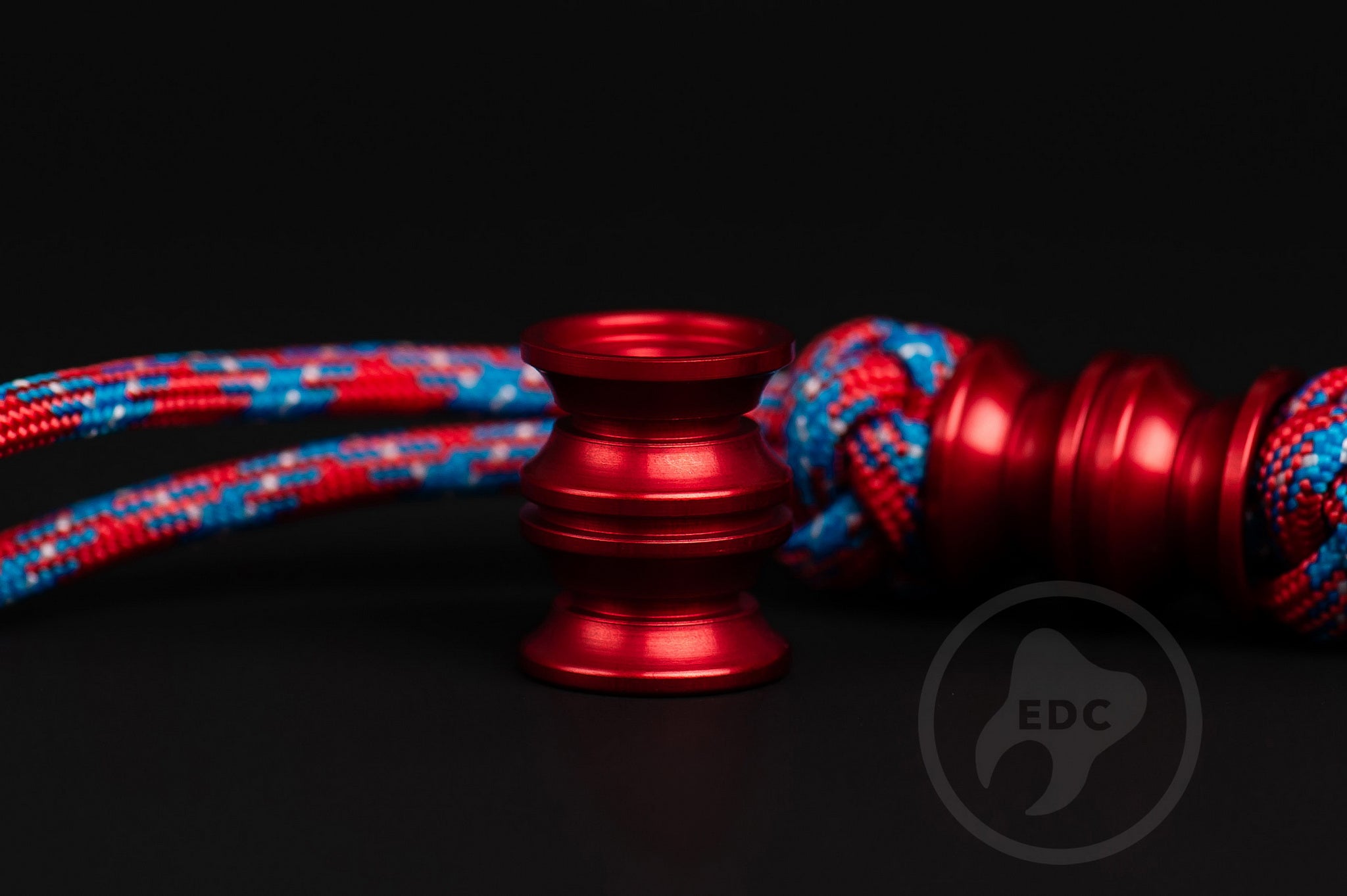 Red Grooved Barrel EDC bead showing the 6mm hole for 550 paracord.