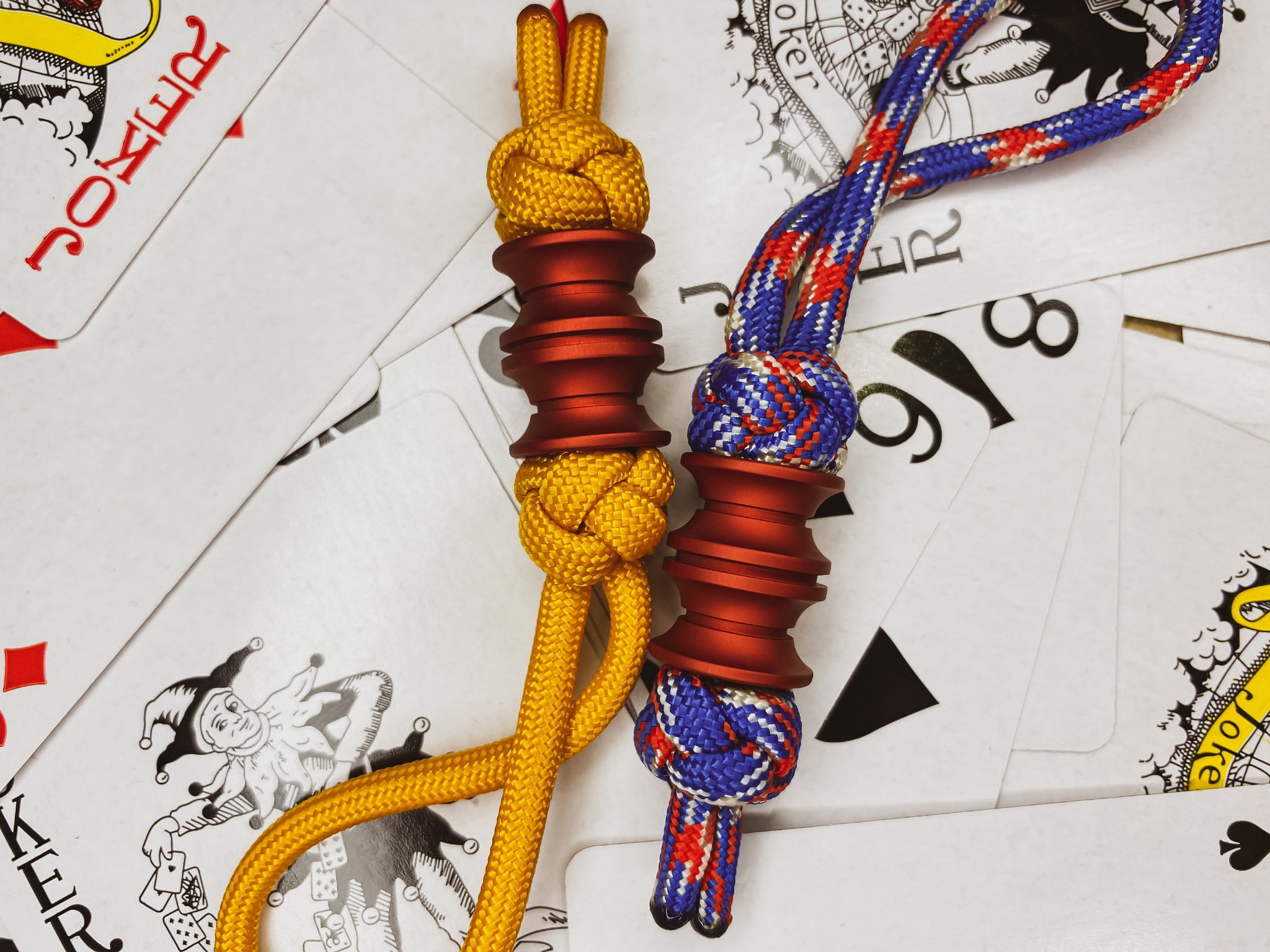 Custom red matte lanyard bead for pocket knives and EDC tool setups.