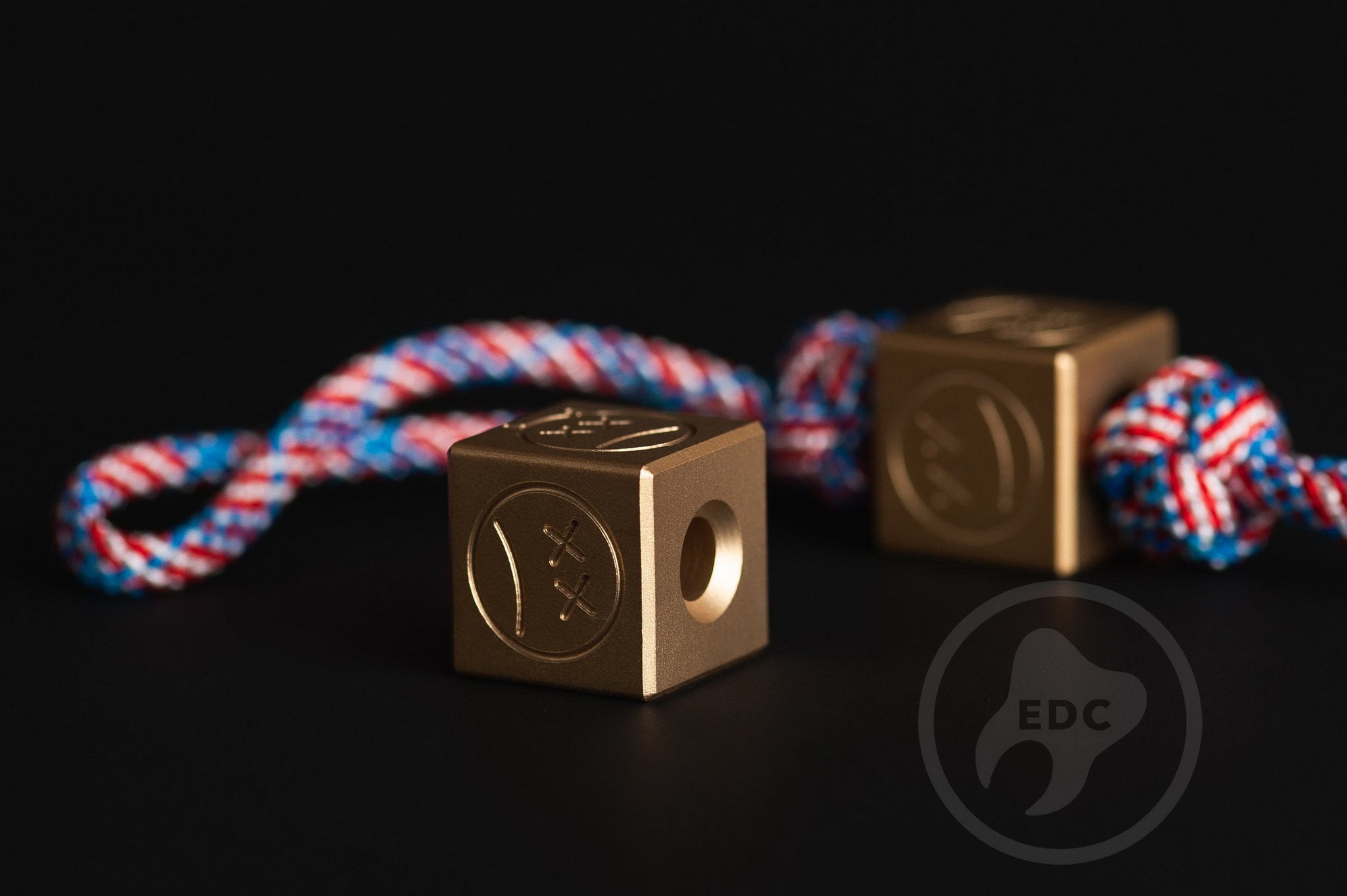 Heavyweight brass cube bead in Everyday Carry style on a paracord lanyard.