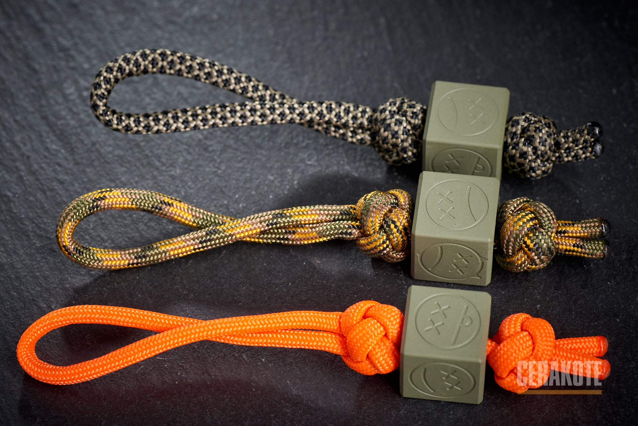 Forest Green Sad Face Cube bead attached to a lanyard.-1