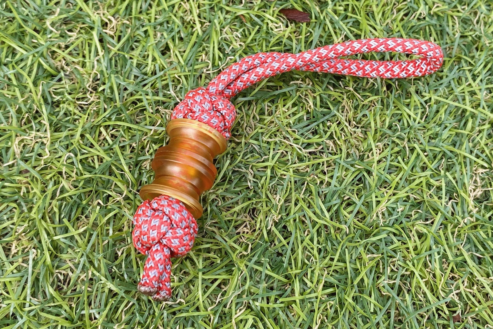 "EDC Gold" Ultem bead on a custom knife lanyard setup.