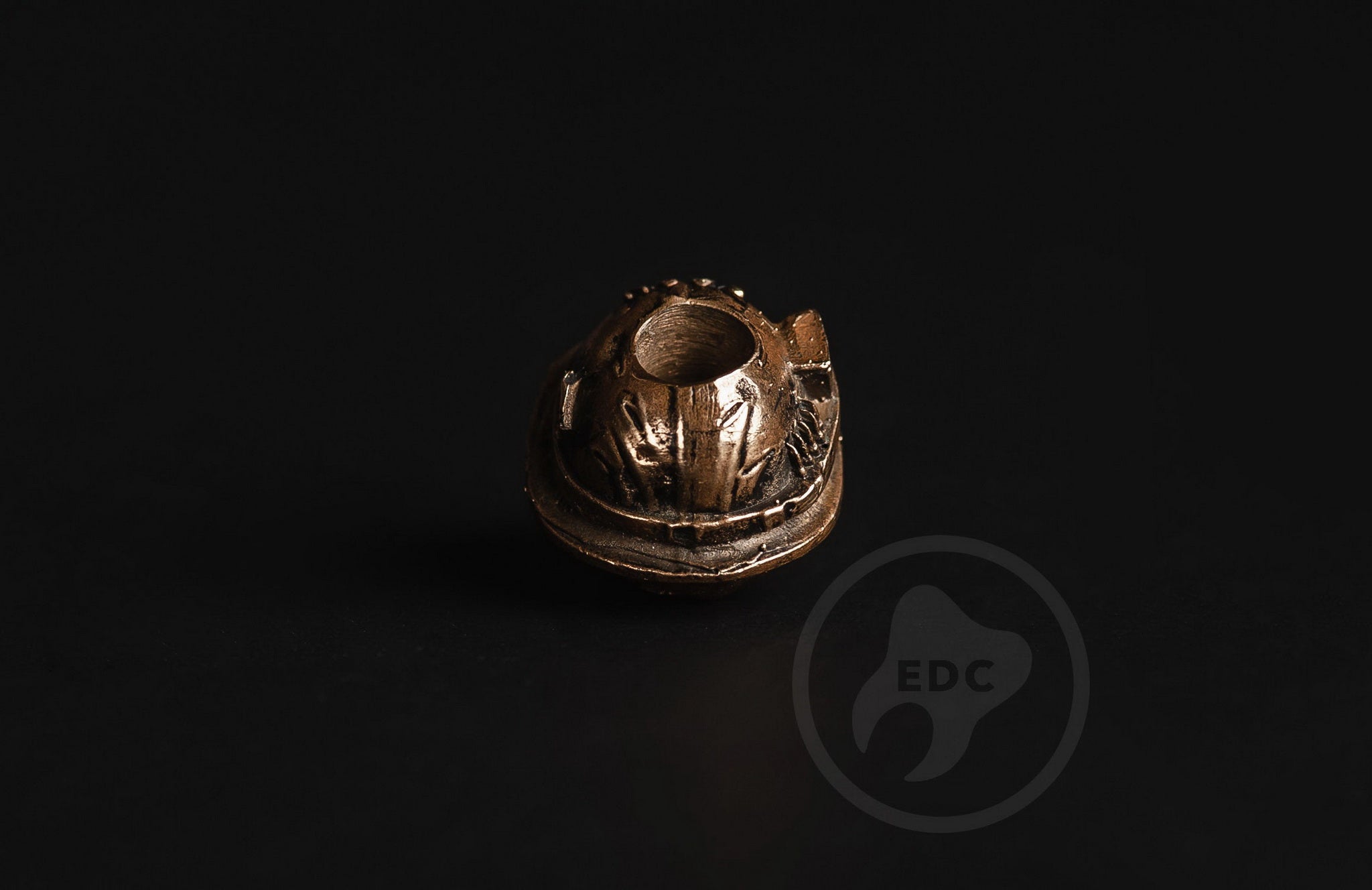 Profile of the combat skull bead showing the antique blackened finish and 6mm hole.-1