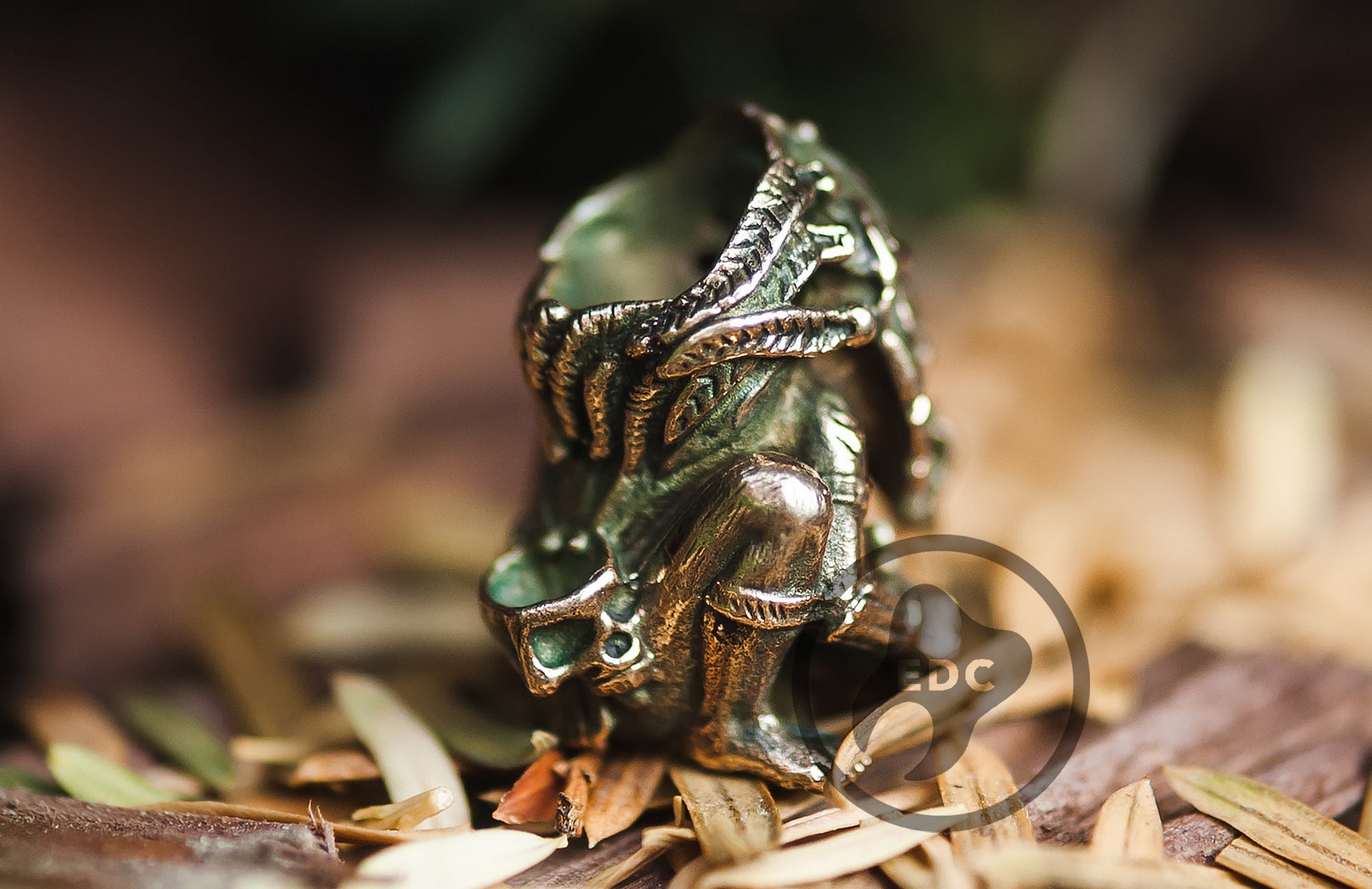 Close-up of the ritualistic details and blackened finish on the Shaman mask bead.-3