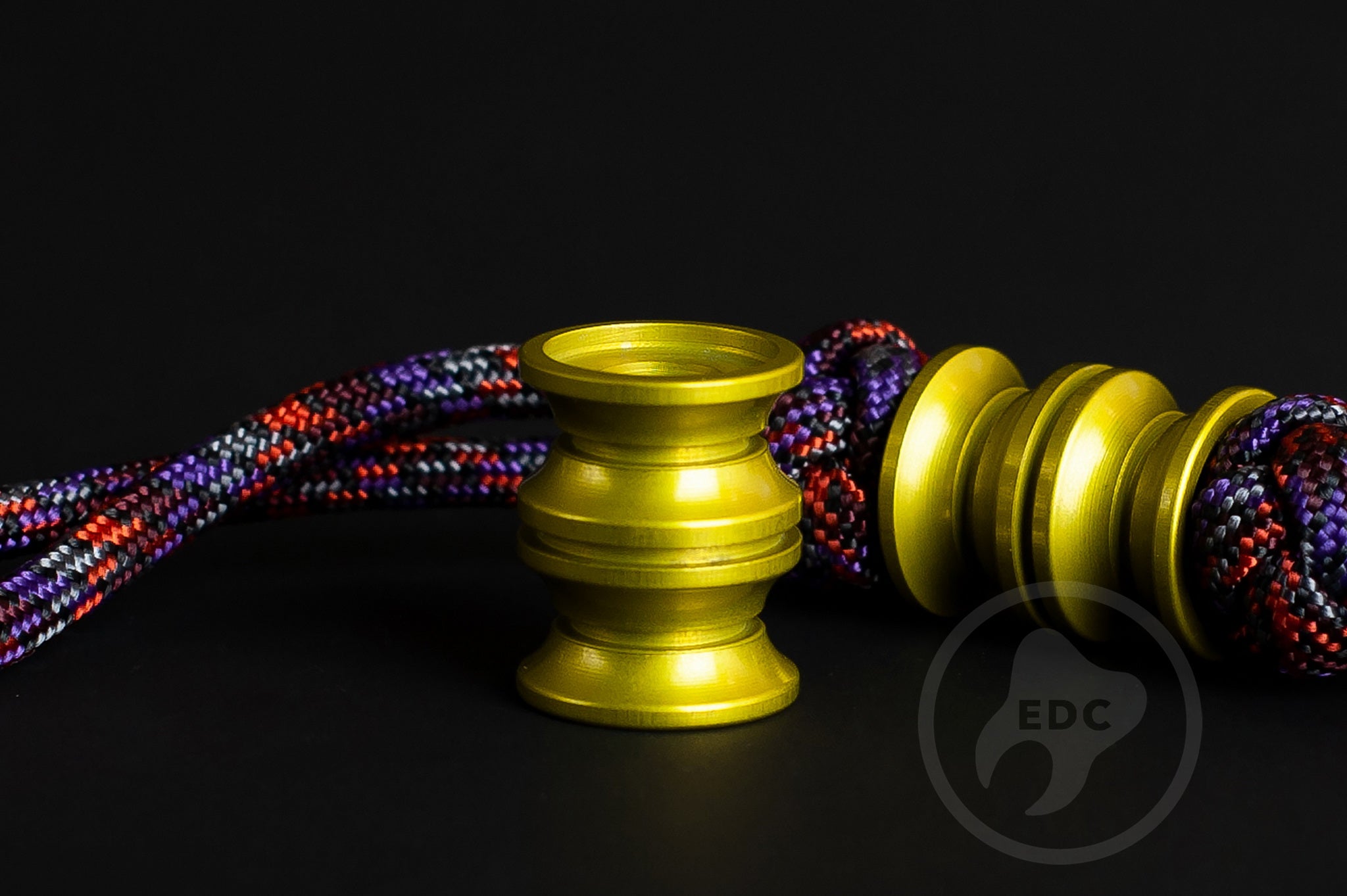 Yellow Grooved Barrel bead showing the 6mm hole for 550 paracord.
