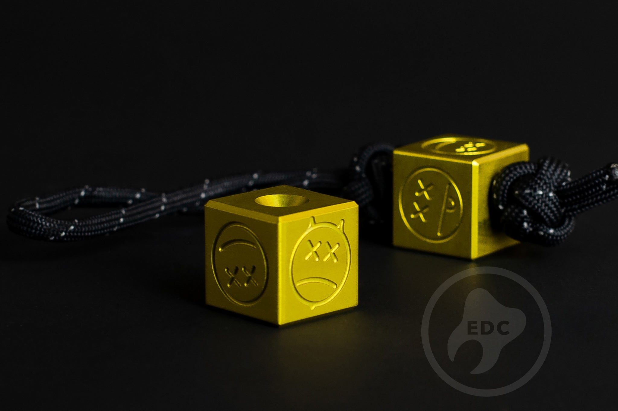 Vibrant yellow Type II anodized aluminum Sad Face Cube bead.