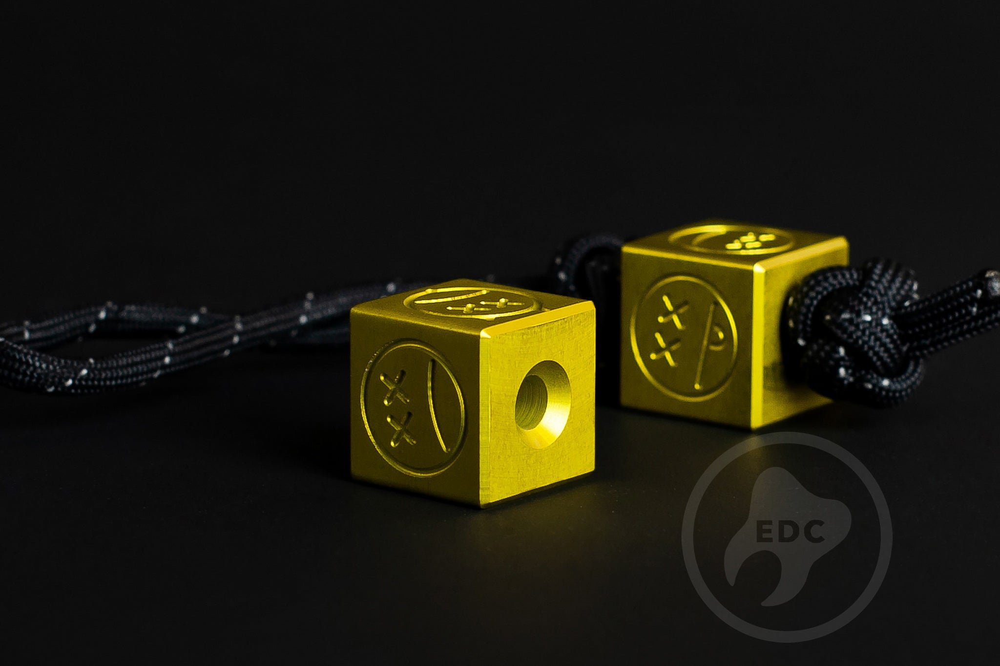 Macro detail of the bright yellow metallic finish on a custom aluminum bead.